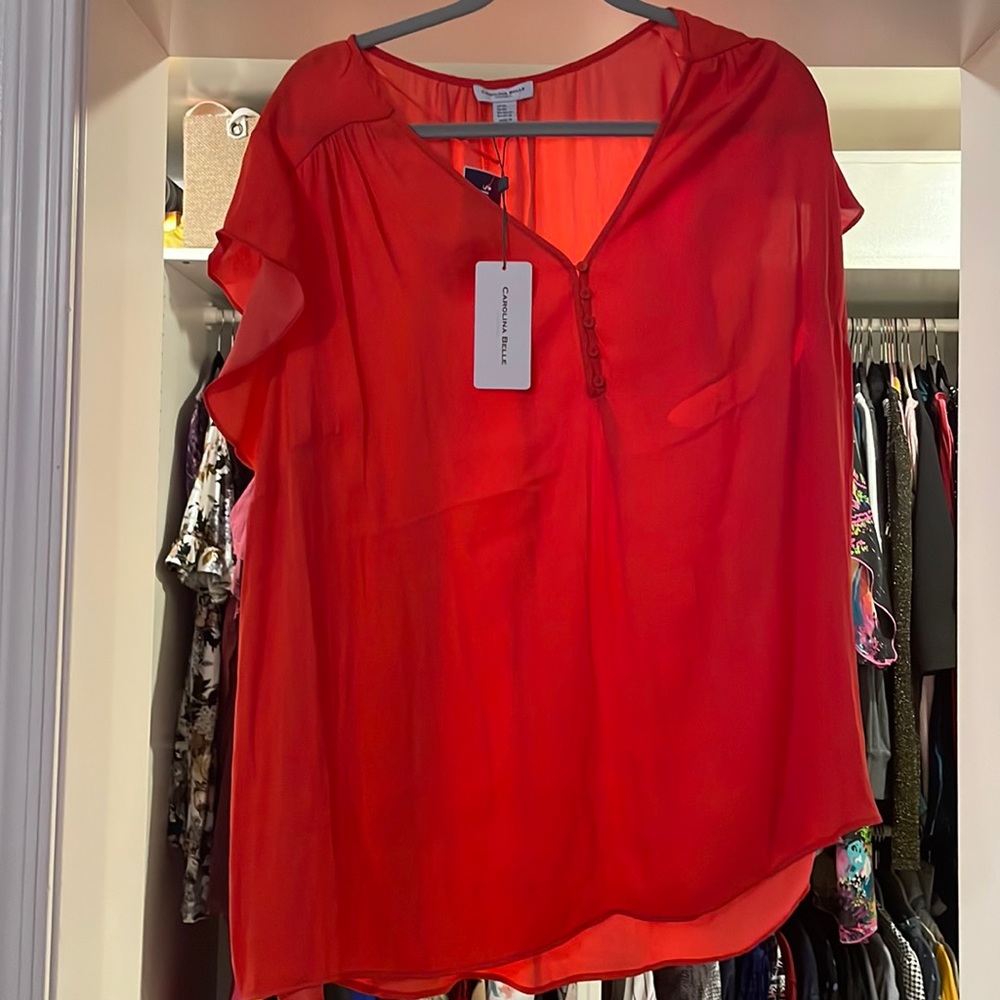 Never worn pinkish reddish top with tags!